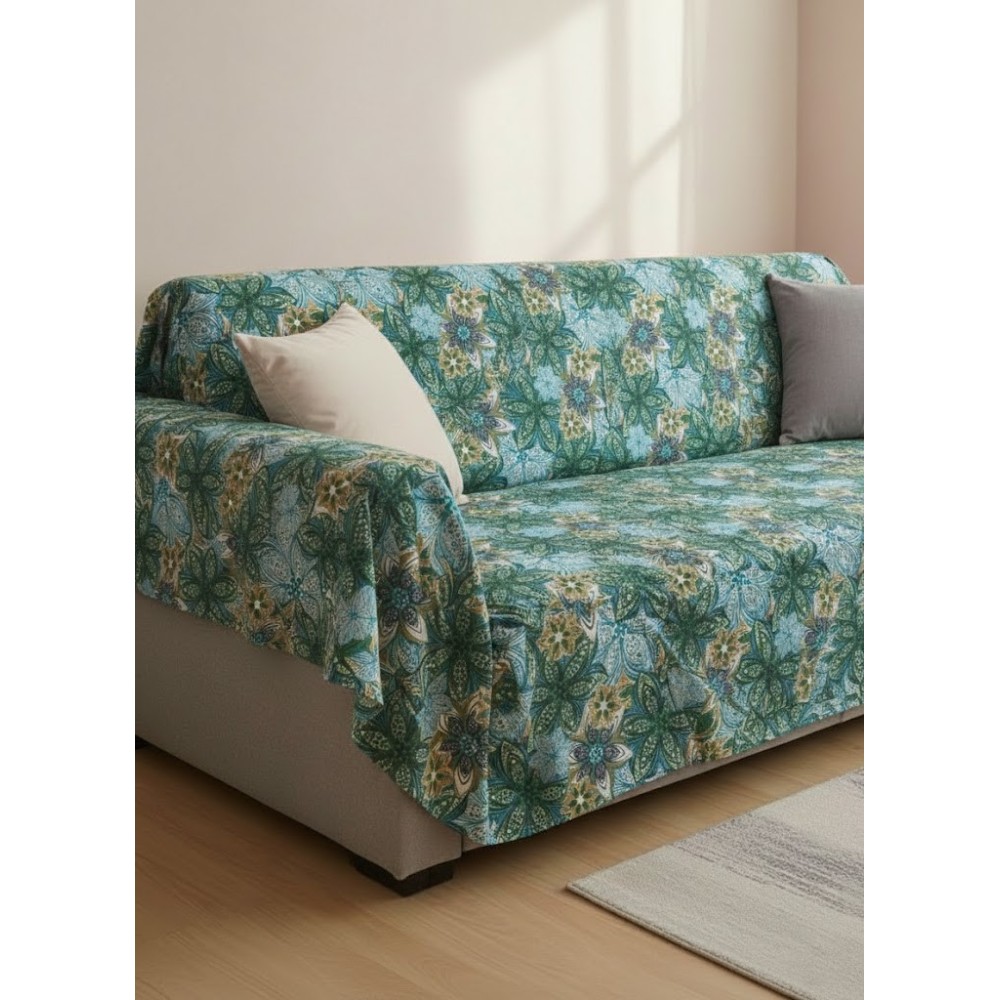 Colcha Multiusos Floral Oasis – 100% Algodón (190x280 cm) sobre un sofa extendida