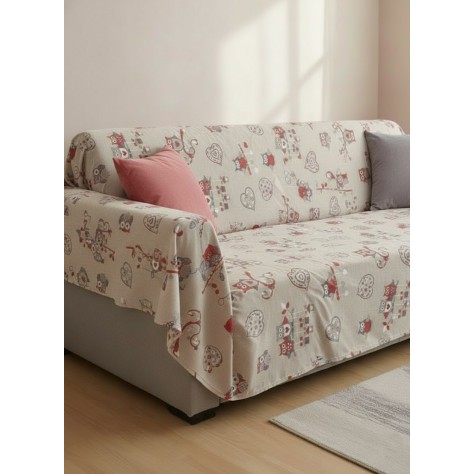 Colcha Multiusos doblada con estampado de Búhos100% Algodón (240x280 cm) extendida sobre un sofa