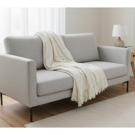 Manta multiusos de Algodón cuadros Crudo sobre un sofa