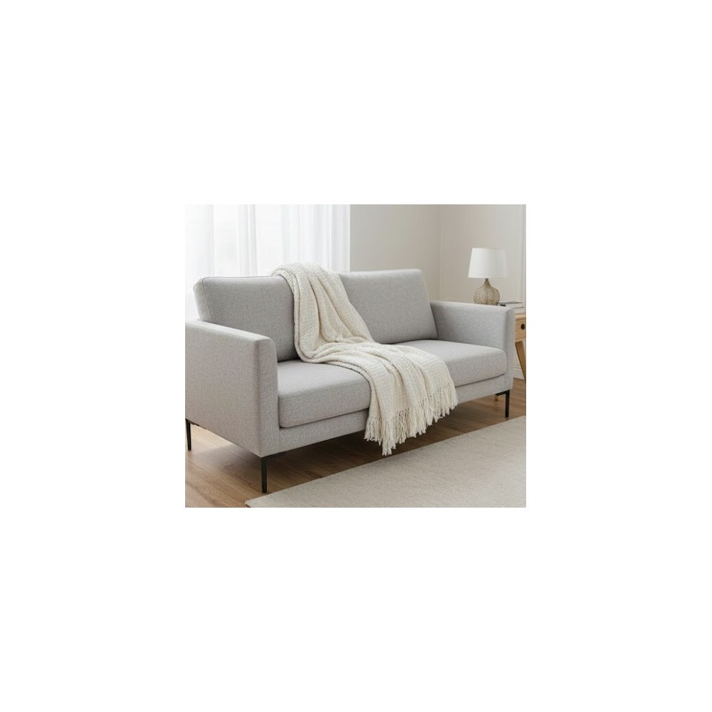 Manta multiusos de Algodón cuadros Crudo sobre un sofa