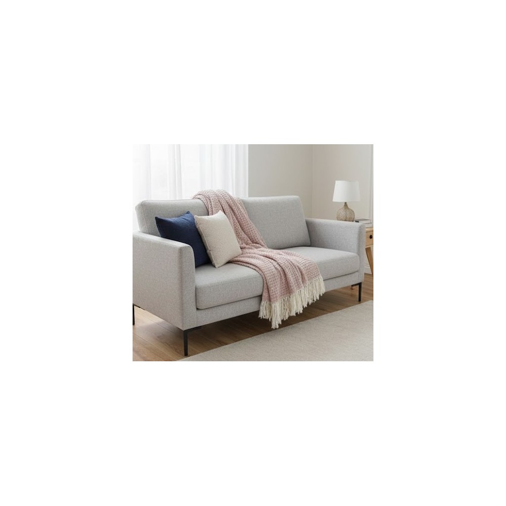 Manta multiusos de Algodón cuadros Rosa sobre un sofa