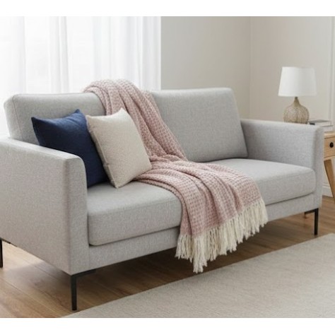 Manta multiusos de Algodón cuadros Rosa sobre un sofa