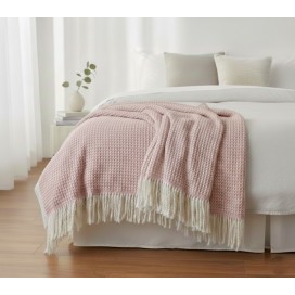 Manta multiusos de Algodón cuadros Rosa  sobre una cama