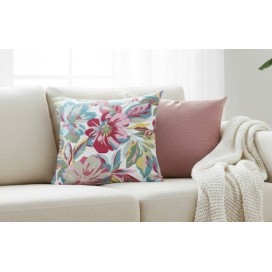 Funda de Cojín Estampado Floral Vibrante (40x40 cm) sobre un sofa