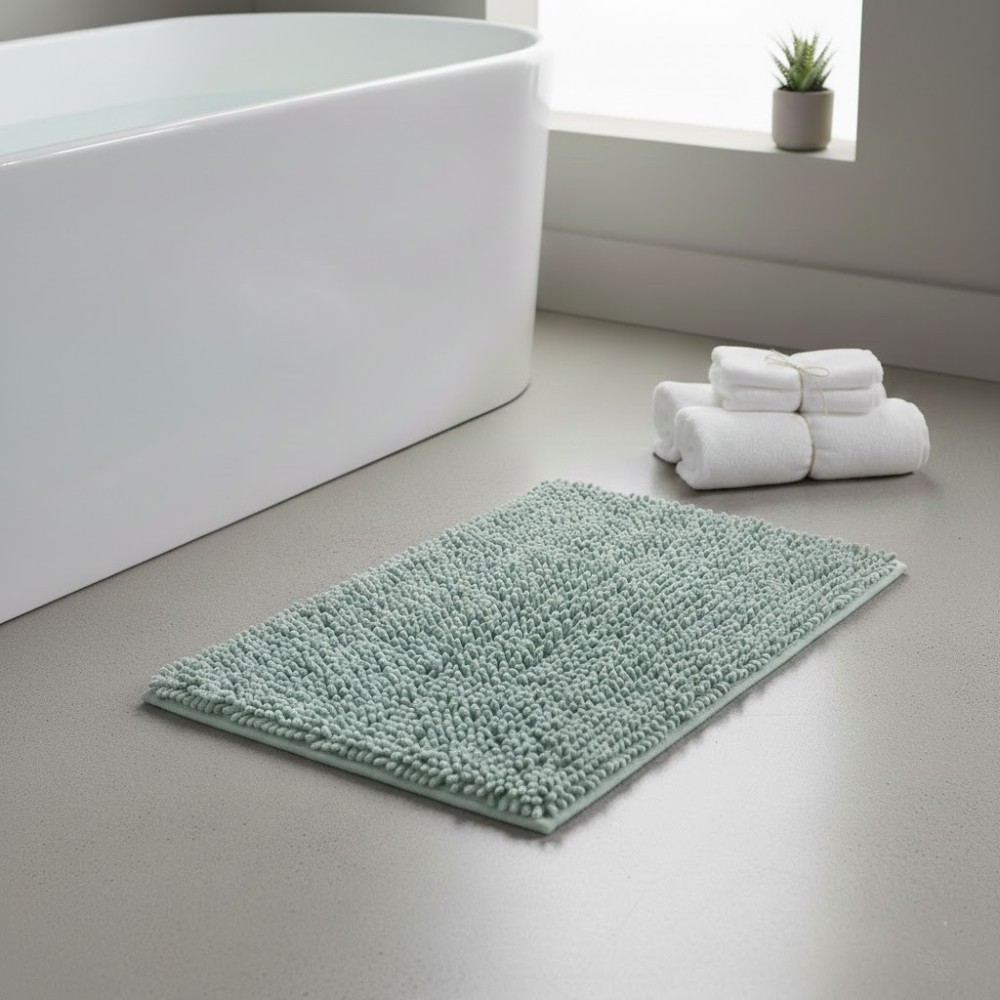 Alfombra de baño Eden Shagy de 60x40 cm en color agua marina con textura de microfibra de poliéster antideslizante.