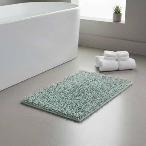 Alfombra de baño Eden Shagy de 60x40 cm en color agua marina con textura de microfibra de poliéster antideslizante.