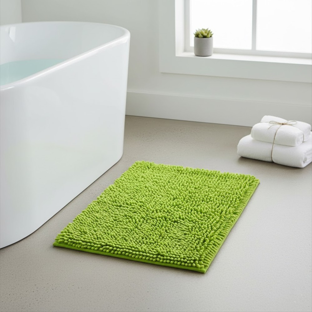 Alfombra de baño Eden Shagy de 60x40 cm en color pistacho con textura de microfibra de poliéster antideslizante.