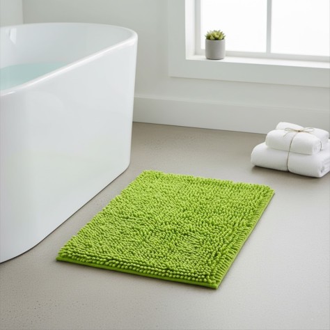 Alfombra de baño Eden Shagy de 60x40 cm en color pistacho con textura de microfibra de poliéster antideslizante.