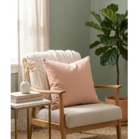 cojin salmon sobre un sillon